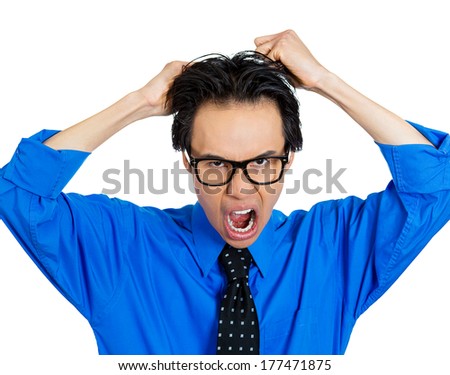 Closeup portrait of stressed, frustrated, nerdy man, pulling his hair out, having panic attack, isolated on white background. Negative human face expressions, emotions, feelings, attitude, perception