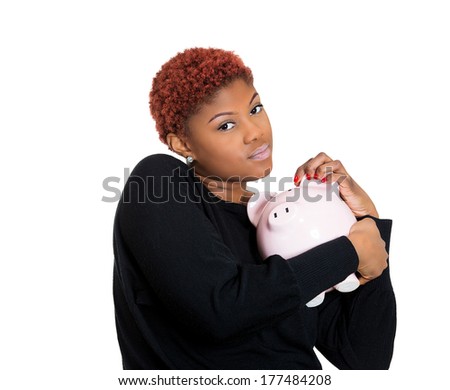 Closeup portrait of young woman, student holding her piggy bank friend in hand, isolate on white background. Positive emotion facial expression feeling. Smart wise saving, financial decision. Nest egg
