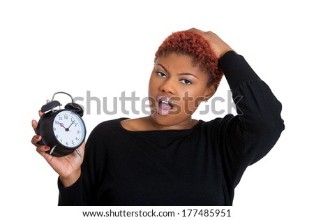 Closeup portrait of a business woman, student, leader holding a clock very stressed, pressured by lack of and running out of time late for a meeting, isolated on a white background. Negative emotions