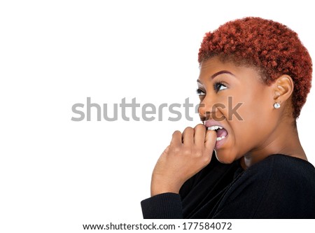 Closeup side view profile portrait of woman with finger in mouth, sucking thumb, biting fingernail in stress, deep thought, isolated on white background. Negative emotion, facial expression, feelings