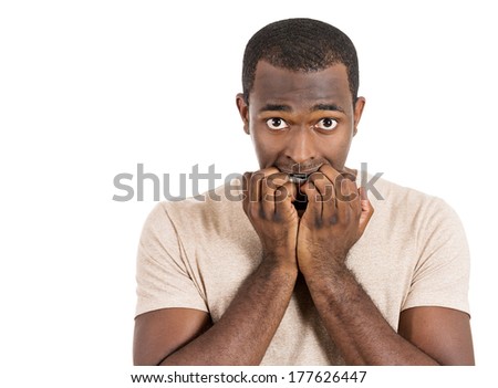 Closeup portrait of nervous stressed man looking funny, scared biting fingernails anxious craving for something staring at you in anticipation isolated on white background. Negative emotion expression
