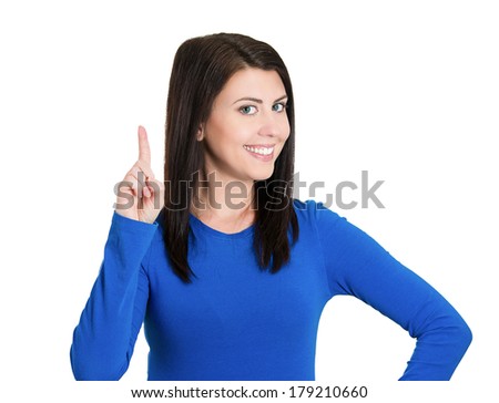 Closeup portrait of beautiful young smiling business woman, pointing with index finger upwards or one sign, isolated on white background. Positive thinking. Emotions, facial expression symbols