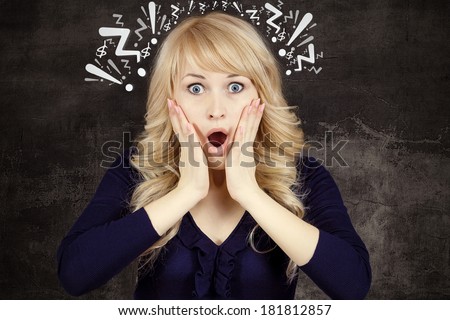 Closeup portrait happy young beautiful woman, looking excited, surprised in full disbelief, hands on face, me? isolated black background with question, exclamation signs. Emotions, facial expression