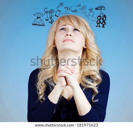 Closeup portrait of sad, funny looking young woman, praying, dreaming, thinking, wishing, hoping, asking, begs for best in life isolated blue background. Emotion, facial expression, feelings, attitude