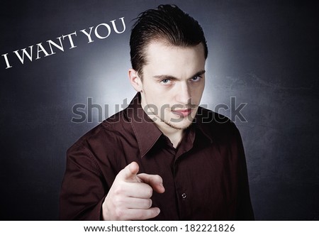 Closeup portrait serious, handsome, confident business man pointing at camera gesture with finger, isolated black grey background with i want you sign. Emotion facial expression, feeling sign, symbol.