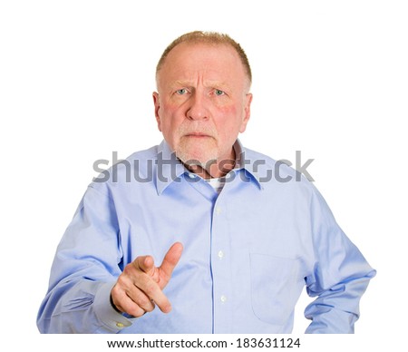 Closeup portrait, serious senior mature man, pointing at you with index finger hand sign gesture, isolated white background. Negative human emotion facial expression feelings, symbols