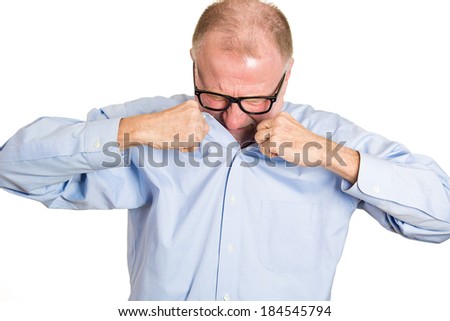 Closeup portrait, senior man, nerd black glasses, sniffing body, something stinks, bad, foul odor situation, isolated white background. Negative human emotions, facial expressions, feeling reaction