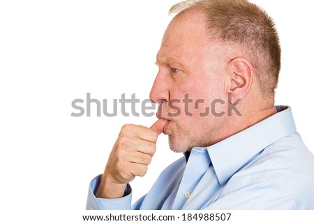 Closeup side view profile portrait, senior mature man with finger in mouth, sucking thumb, biting fingernail, deep in thought, isolated white background. Negative emotion, facial expression, feeling