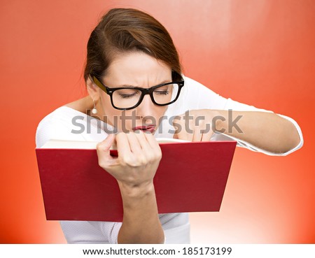 Closeup portrait young, nerdy woman with big black eye glasses trying to read book but having difficulties seeing text because of vision problems. Negative emotion facial expression feelings