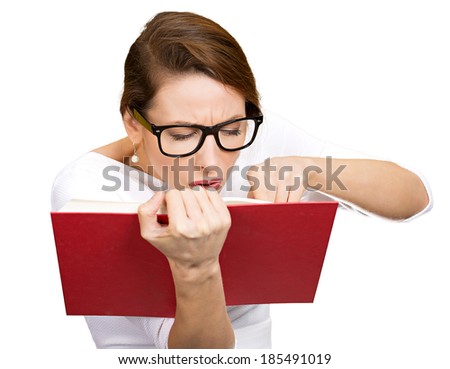 Closeup portrait young, nerdy woman with big black eye glasses trying to read book but having difficulties seeing text because of vision problems, clipping path. Negative emotion facial expression