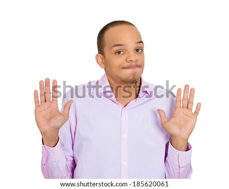 Closeup portrait, helpless young man raising hand up to say no stop right there, don't want it, isolated white background. Negative emotion facial expression feelings, signs symbols, body language
