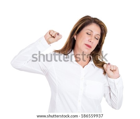 Closeup portrait, mature, tired fatigued woman stretching extending arms, back, shoulders, waking up, isolated white background. Positive human emotion facial expression feeling