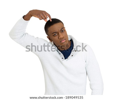 Closeup portrait, young man thinking daydreaming trying hard to remember something scratching head, isolated white background. Negative emotion facial expressions feelings. Short-term memory loss