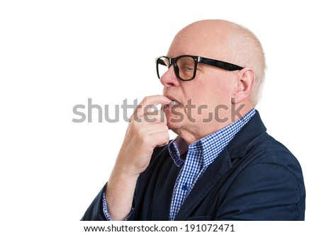 Closeup side view profile portrait, headshot senior mature man, finger in mouth, sucking, biting fingernail, deep in thought, isolated white background. Negative emotion, facial expression, feelings