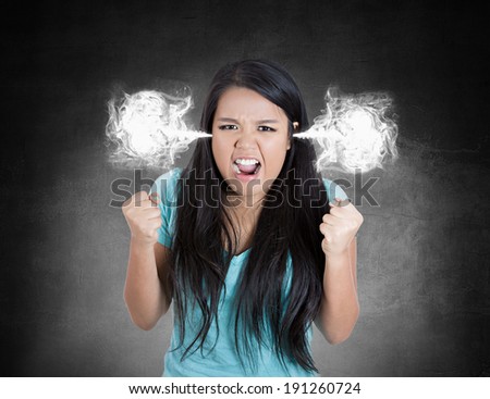Closeup portrait angry, mad young woman, blowing steam coming out of ears about to have nervous atomic breakdown isolated black background. Negative human emotion, facial expression, feeling, attitude