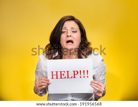 Closeup portrait stressed overwhelmed, screaming young woman, student, worker, holding help sign isolated yellow background. Negative human emotion, face expression, feelings, reaction life perception