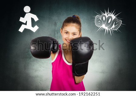 Closeup portrait young, cute girl wearing boxing gloves smiling, excited, ready to fight, win, isolated dark, black background. Positive human emotions, facial expression, reaction, determination