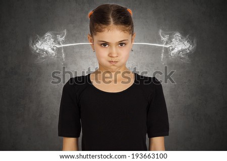 Closeup portrait angry young girl, blowing steam coming out of ears, about have nervous atomic breakdown, isolated black background. Negative human emotions facial expression feeling attitude reaction