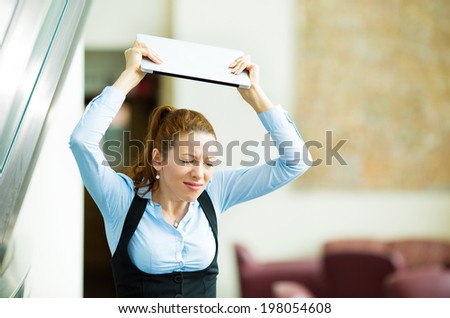 Portrait stressed, angry businesswoman throwing her tablet computer, laptop, isolated background corporate office. Negative human emotions, facial expressions, feelings, reaction, life perception