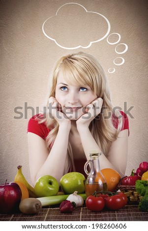 Closeup portrait fit happy smiling young woman, girl siting at table with fruits, vegetables, thinking, daydreaming, making healthy diet choices isolated grey background with bubble Positive emotions