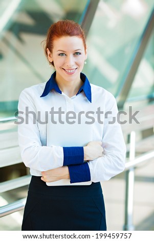 Closeup portrait happy, smiling business woman. Corporate, education life concept. Female student with folders, isolated background company office. Positive human emotions, facial expression, attitude