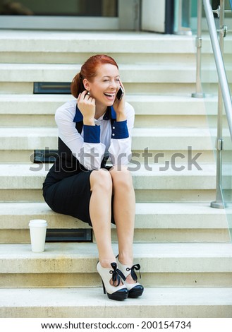 Portrait happy smiling businesswoman talking on mobile cell phone on her coffee break sitting outdoor. Business woman having conversation on cellphone isolated stairs background. Communication concept