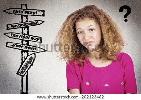 Closeup portrait confused, young girl asking where to go in life, not sure which way, where  isolated gray background, thought bubble with questions, directions. Emotions, facial expression, feeling