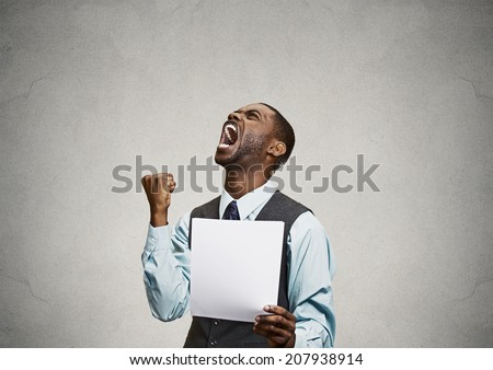 Closeup portrait angry, mad, screaming business man holding paper, document, screaming, looking up isolated grey background. Negative emotions, facial expressions, feeling. Financial crisis, bad news