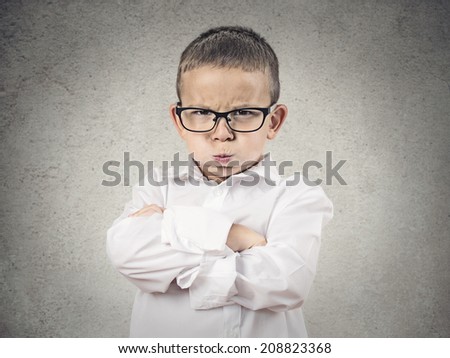 Closeup portrait Angry Boy, Blowing Steam, puffing out his cheeks about to have Nervous atomic breakdown, isolated grey background. Negative human emotion, Facial Expression feeling attitude reaction