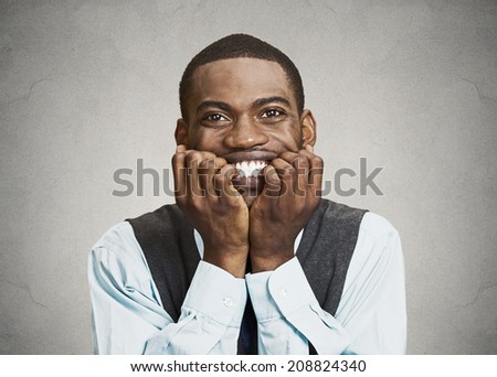 Closeup portrait, headshot Scared, worried, Anxious Businessman Biting Nails, Fingers in mouth isolated grey, black background. Negative human Emotions, face Expressions, body language, perception