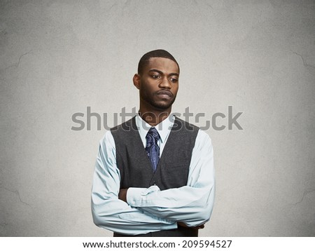 Closeup Portrait, headshot angry, Annoyed handsome Business Man avoiding eye contact, tired of fruitless conversation looking to right, isolated grey wall background with copy space. Body language