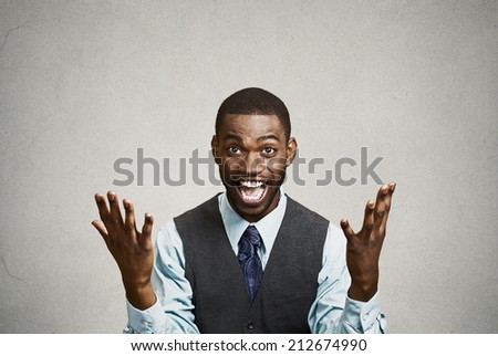 Closeup portrait happy successful student, business man winning, fists pumped celebrating success isolated grey wall background. Positive human emotion, facial expression. Life perception, achievement
