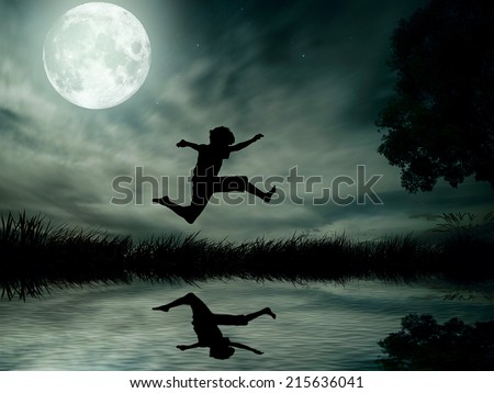 Happy boy, teenager jumping in water, over lake with moonlight, moon background, body reflection in water. Outdoor exciting summer vacation, travel life, leisure. Lifestyle freedom concept. Dreamland