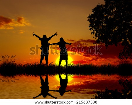 Silhouette happy excited carefree couple looking at sunset, body reflection in lake water. Outdoor exciting summer vacation, travel life, leisure, fun lifestyle freedom concept. Positive human emotion