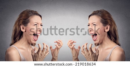 Closeup portrait angry woman hysterical having nervous breakdown screaming pissed off  at herself in mirror isolated grey wall background. Negative human emotion facial expression feeling bad attitude