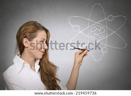 learning physics science. portrait attractive woman, teacher explaining physics lessons in class, standing by blackboard. Education, research, knowledge concept. Positive human face expressions