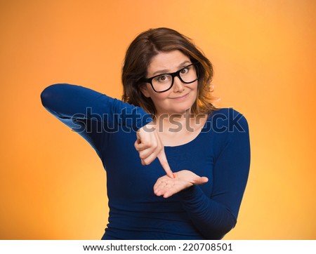 middle aged woman asking to pay money back, finger on palm gesture, isolated orange background. Human face expression, emotions, feeling, body language non verbal communication. Financial debt concept