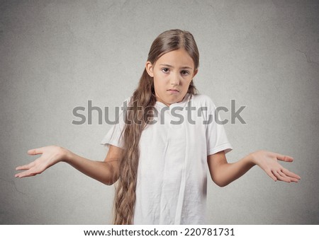 Closeup portrait clueless unhappy teenager girl with arms out asking what\'s problem who cares so what I don\'t know isolated grey wall background. Negative human emotion facial expression body language