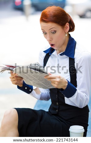 Shocked, astonished businesswoman reading newspaper, bad news isolated outside city street background. Human face expressions, emotions, feelings, body language, reaction. Yellow press news concept