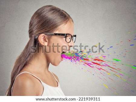 Side view profile portrait angry woman screaming colorful splashes coming out of open mouth isolated grey background. Negative human face expression emotion bad feeling reaction.Conflict confrontation