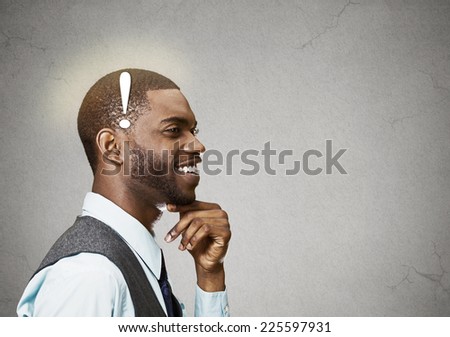 Portrait side view profile headshot happy man thinking found solution for problem isolated grey wall background with copy space. Human face expression emotion feeling body language perception iq