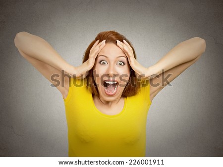 Closeup portrait happy cute young beautiful woman looking excited surprised in full disbelief hands on head it\'s me isolated grey wall background. Positive human emotion facial expression feeling