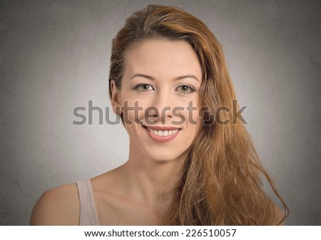 beautiful smiling girl isolated on grey wall background. positive human face expression emotion