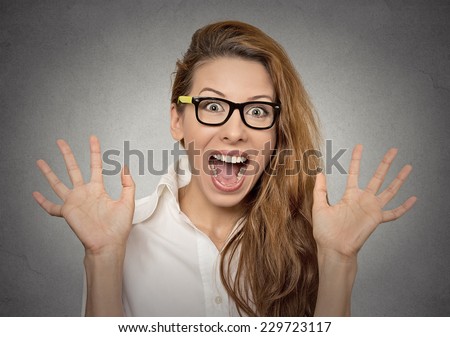 super excited funky young girl looking thrilled very happy isolated on grey wall background