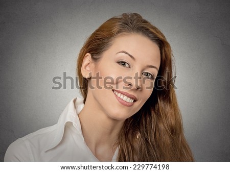 Smiling beautiful young happy woman isolated on grey wall background. Positive life perception, attitude