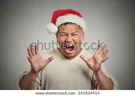 Portrait, bitter, displeased angry, grumpy man yelling screaming isolated grey wall background. Negative human emotion facial expression