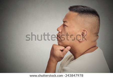 Side profile headshot portrait thoughtful middle aged man isolated on grey wall background. Human face expression emotion feeling perception
