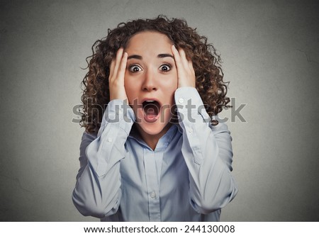 Shocked surprised stunned. Closeup portrait happy young woman looking excited in full disbelief hands on head it\'s me? isolated grey background. Positive human emotion facial expression reaction