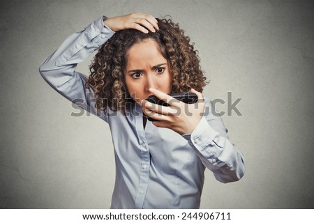 Closeup portrait shocked funny looking young woman, feeling head, surprised she is losing hair has receding hairline upset isolated grey wall background. Negative facial expression emotion, reaction