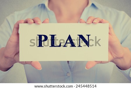 Closeup retro image businesswoman, female hands holding white sign or card with message plan isolated on gray office wall background. customer service concept